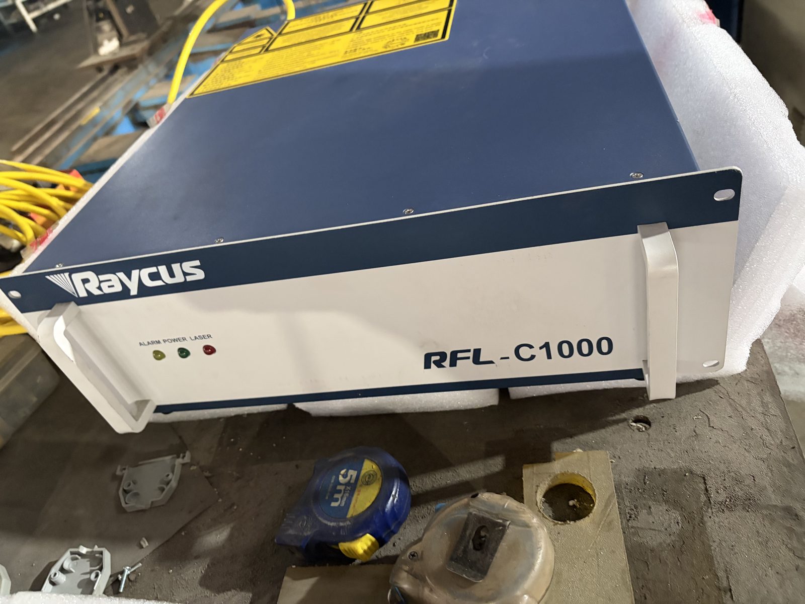 Raycus RFL-C1000 CW fiber laser generator in our workshop — photo with packing foam